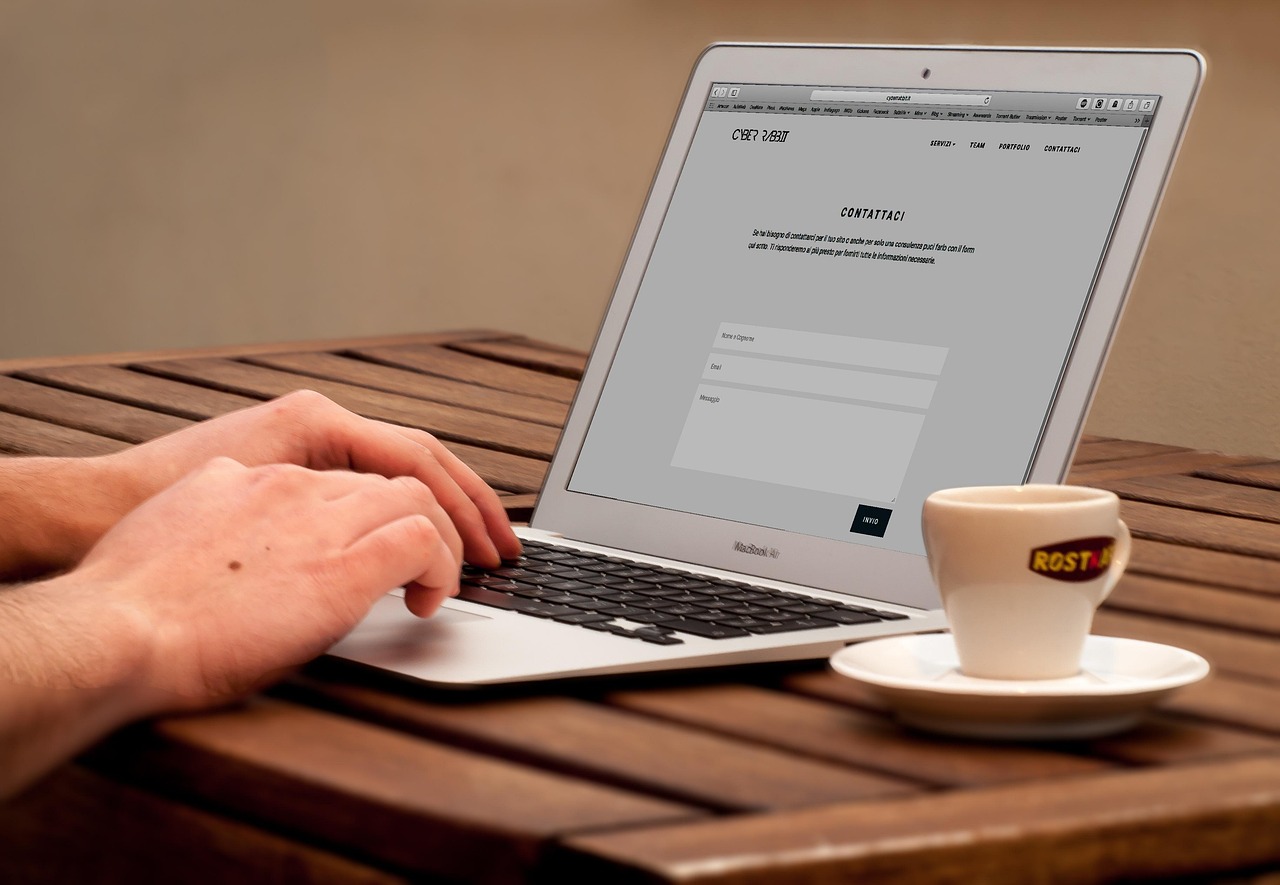 Laptop displaying web design graphics and interface elements